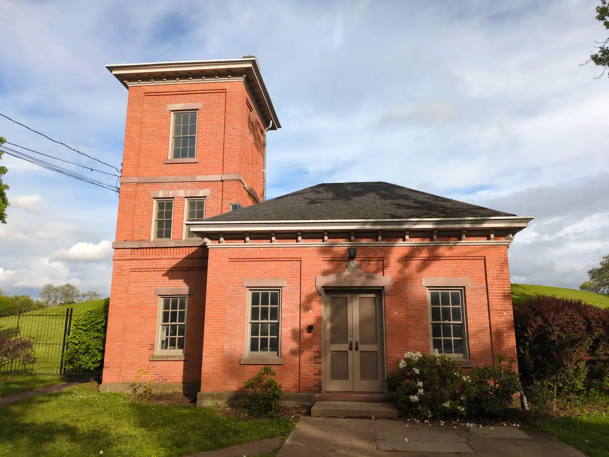A small red brick building that reads "Rochester Water Works"